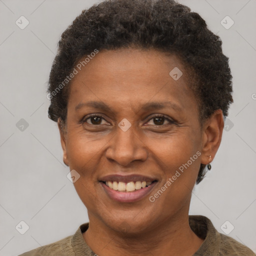 Joyful black adult female with short  brown hair and brown eyes