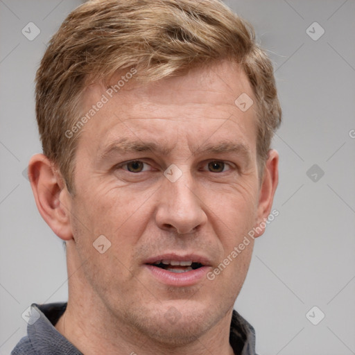 Joyful white adult male with short  brown hair and grey eyes