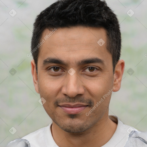Joyful latino young-adult male with short  black hair and brown eyes