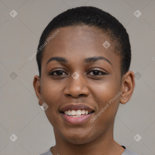 Joyful black young-adult female with short  black hair and brown eyes