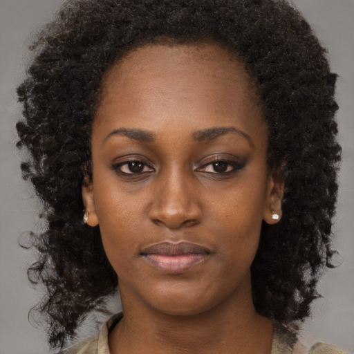Neutral black young-adult female with long  brown hair and brown eyes
