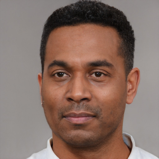 Neutral black young-adult male with short  black hair and brown eyes