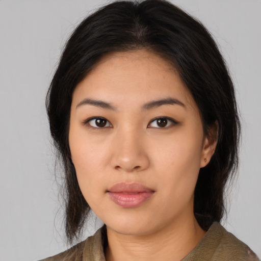 Neutral asian young-adult female with medium  brown hair and brown eyes