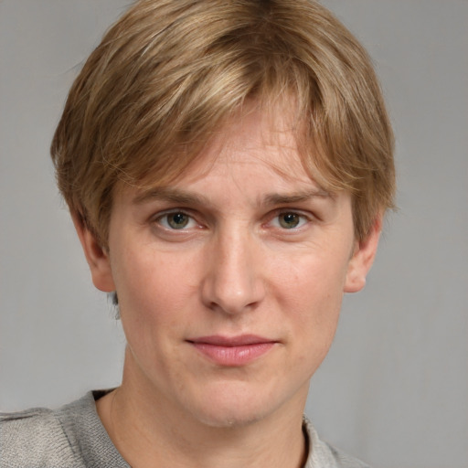 Joyful white adult male with medium  brown hair and blue eyes