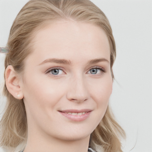 Joyful white young-adult female with long  brown hair and blue eyes