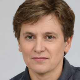 Joyful white adult male with short  brown hair and grey eyes