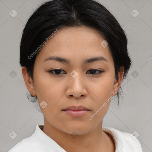 Joyful asian young-adult female with short  black hair and brown eyes