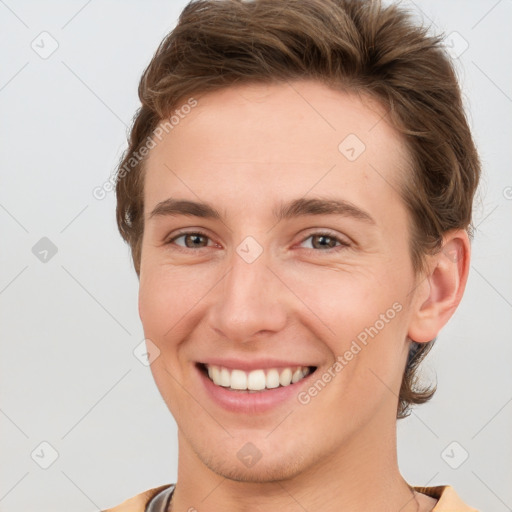 Joyful white young-adult female with short  brown hair and grey eyes