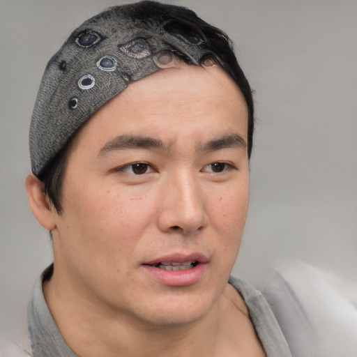 Neutral asian young-adult male with short  brown hair and brown eyes