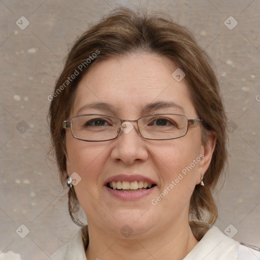 Joyful white adult female with medium  brown hair and blue eyes