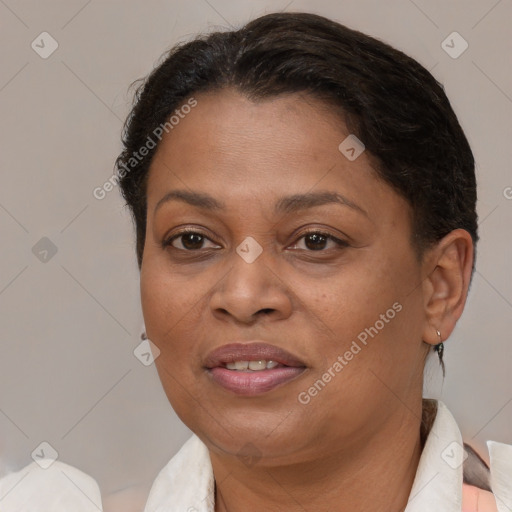 Joyful black adult female with short  brown hair and brown eyes