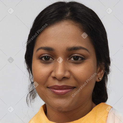 Joyful black young-adult female with medium  brown hair and brown eyes