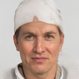 Joyful white adult male with short  brown hair and grey eyes