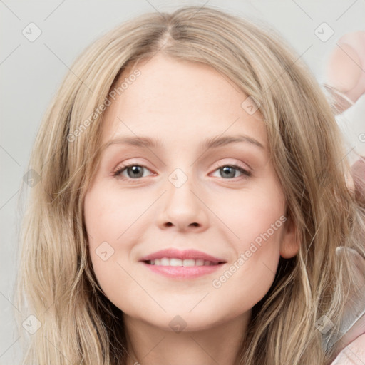 Joyful white young-adult female with long  brown hair and blue eyes