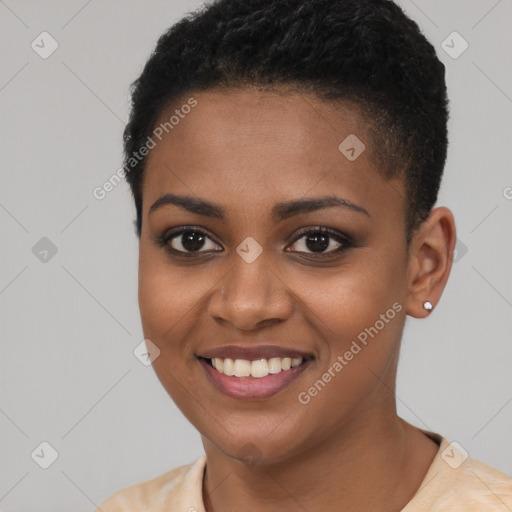 Joyful black young-adult female with short  brown hair and brown eyes