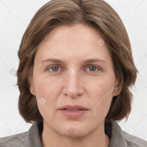 Joyful white adult female with medium  brown hair and grey eyes