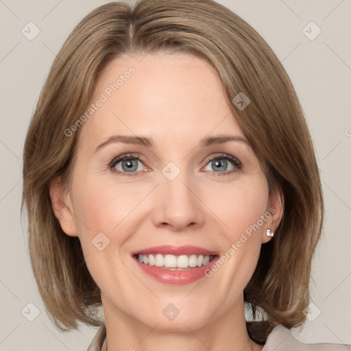 Joyful white adult female with medium  brown hair and grey eyes