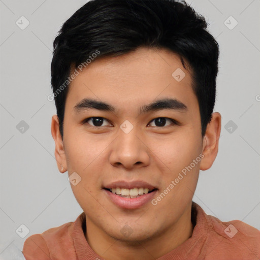 Joyful asian young-adult male with short  black hair and brown eyes