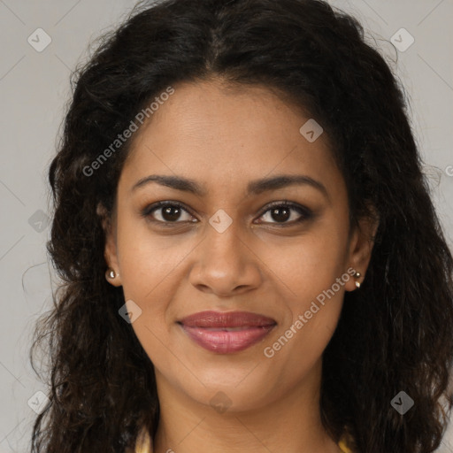 Joyful black young-adult female with long  brown hair and brown eyes