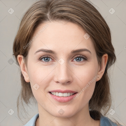 Joyful white young-adult female with medium  brown hair and grey eyes