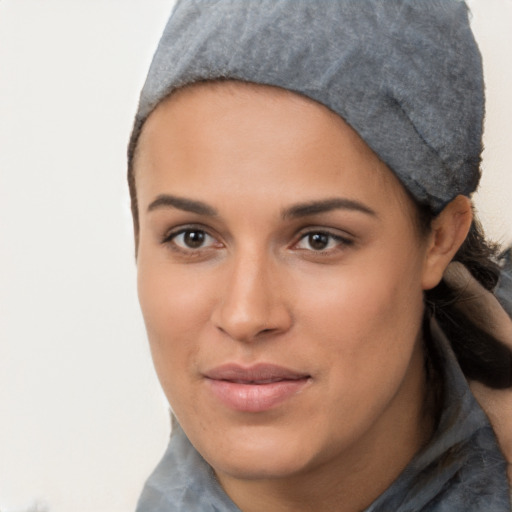 Joyful latino young-adult female with medium  black hair and brown eyes