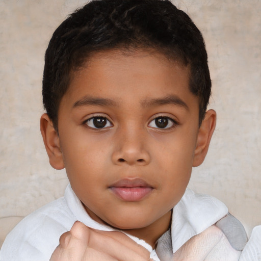 Neutral latino child male with short  brown hair and brown eyes