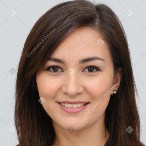 Joyful white young-adult female with long  brown hair and brown eyes