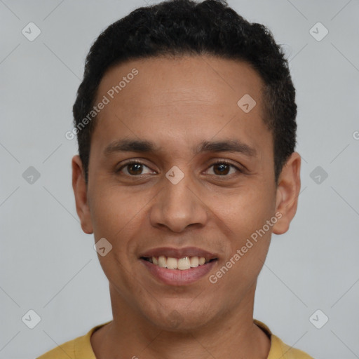 Joyful latino young-adult male with short  black hair and brown eyes