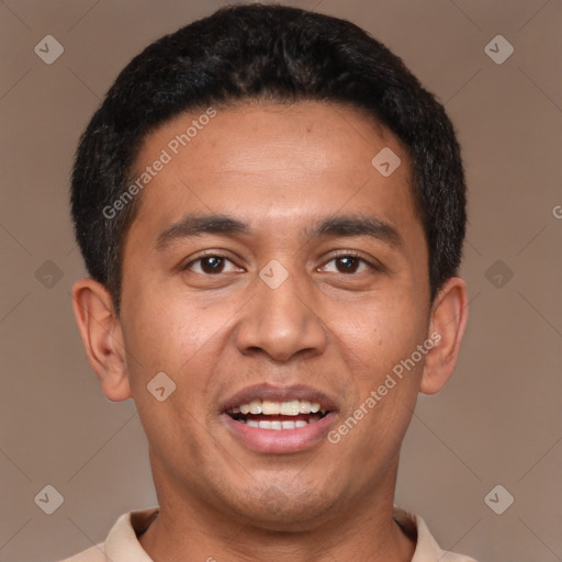 Joyful latino young-adult male with short  black hair and brown eyes