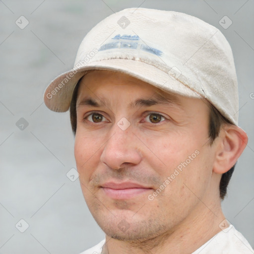 Joyful white adult male with short  brown hair and brown eyes