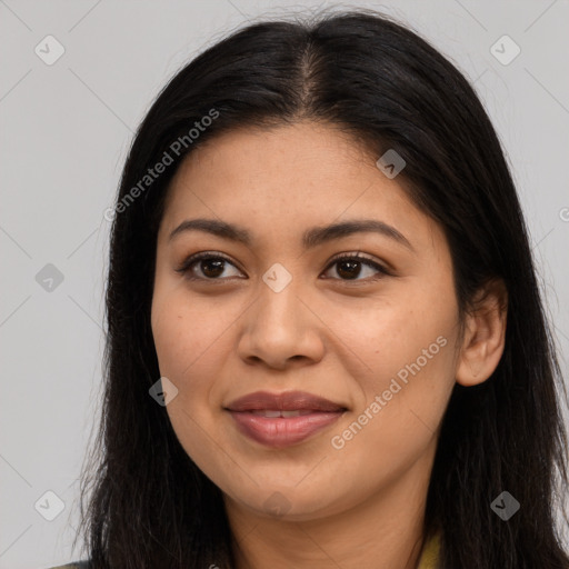 Joyful latino young-adult female with long  brown hair and brown eyes