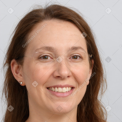 Joyful white adult female with long  brown hair and grey eyes