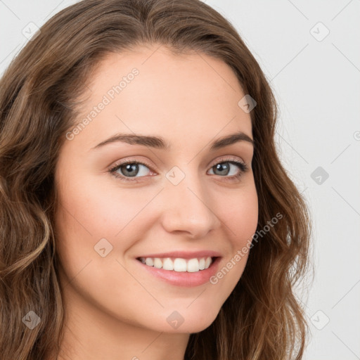 Joyful white young-adult female with long  brown hair and blue eyes