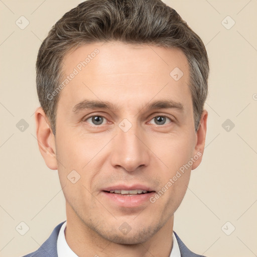 Joyful white adult male with short  brown hair and brown eyes