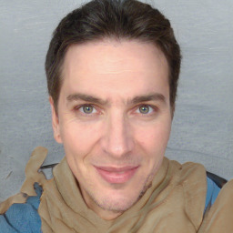 Joyful white adult male with short  brown hair and grey eyes