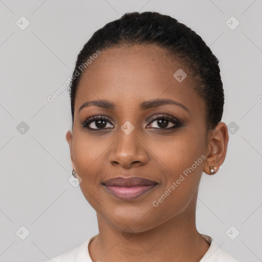 Joyful black young-adult female with short  black hair and brown eyes