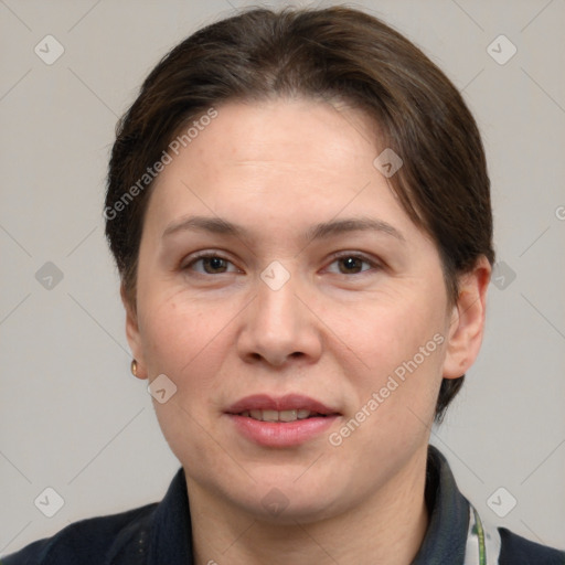 Joyful white adult female with short  brown hair and grey eyes