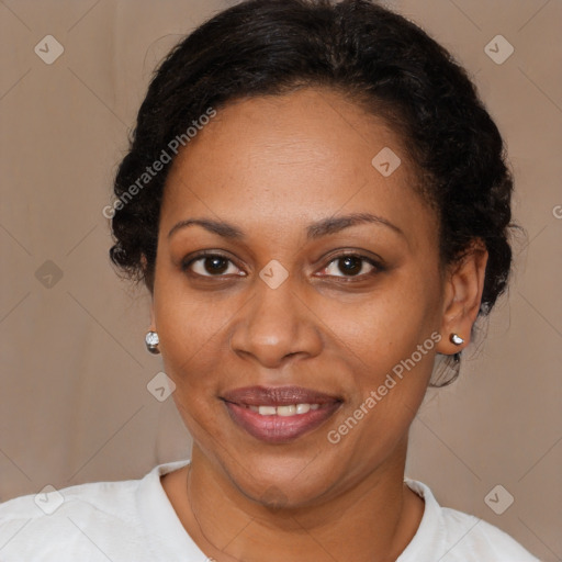 Joyful black adult female with short  brown hair and brown eyes