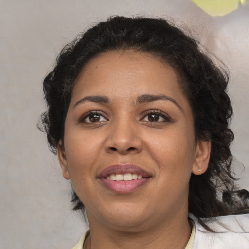Joyful white young-adult female with medium  black hair and brown eyes
