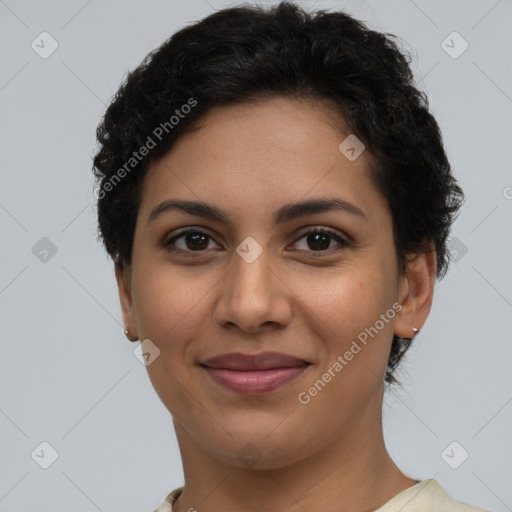 Joyful latino young-adult female with short  brown hair and brown eyes