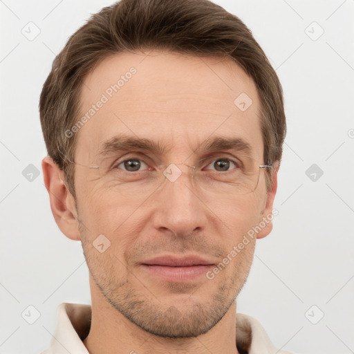 Joyful white adult male with short  brown hair and grey eyes