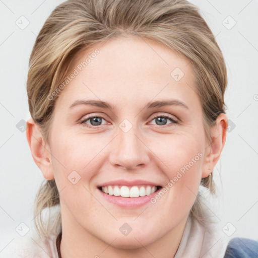 Joyful white young-adult female with medium  brown hair and blue eyes