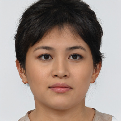 Joyful asian young-adult female with medium  brown hair and brown eyes