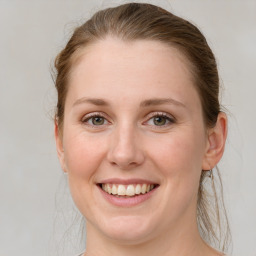 Joyful white young-adult female with medium  brown hair and blue eyes