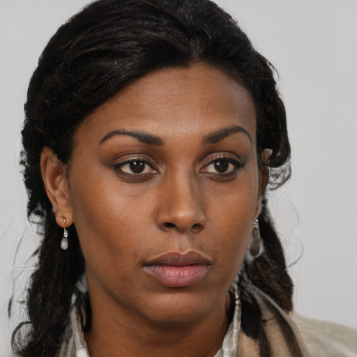 Neutral black young-adult female with long  brown hair and brown eyes