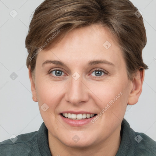 Joyful white young-adult female with short  brown hair and grey eyes