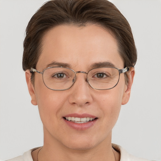 Joyful white adult female with short  brown hair and grey eyes