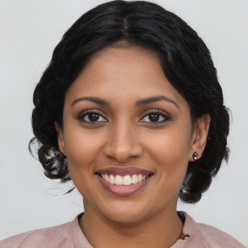 Joyful latino young-adult female with medium  black hair and brown eyes