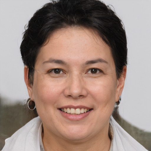 Joyful white adult female with short  brown hair and brown eyes