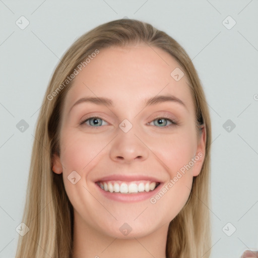 Joyful white young-adult female with long  brown hair and blue eyes